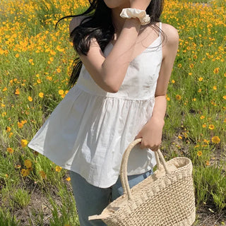 White flared sleeveless bustier blouse