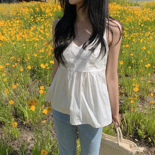 White flared sleeveless bustier blouse