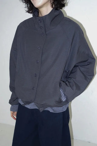 High-neck windbreaker with buttons