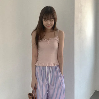 Frilled button sleeveless