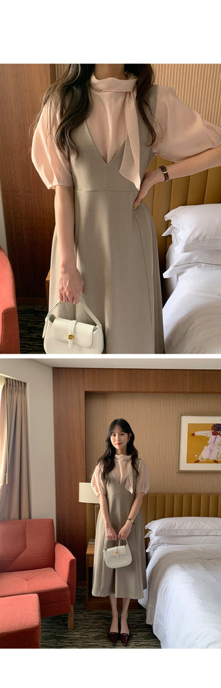 Short-sleeved blouse with puff tie
