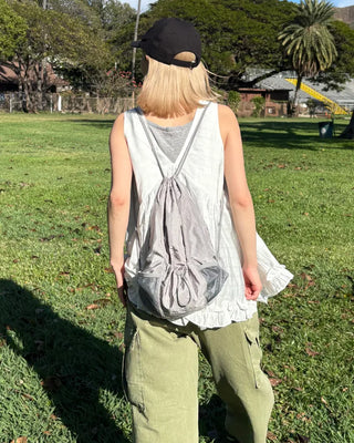 Drawstring net pocket backpack
