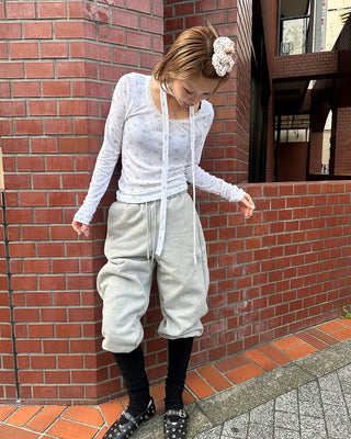 Open-heel ribbed knee-high socks layered pants