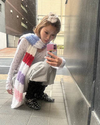 Open-heel ribbed knee-high socks layered pants