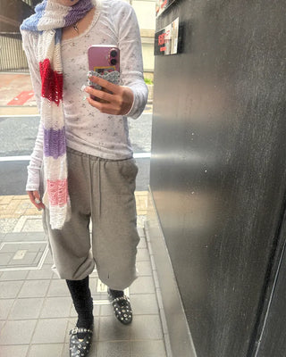 Open-heel ribbed knee-high socks layered pants