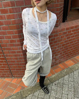 Open-heel ribbed knee-high socks layered pants