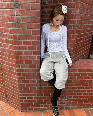 Open-heel ribbed knee-high socks layered pants