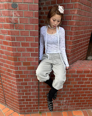 Open-heel ribbed knee-high socks layered pants