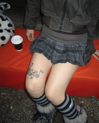 Tartan check studded mini pleated skirt