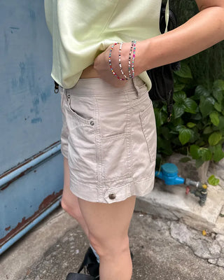 Adjustable tab side pocket shorts