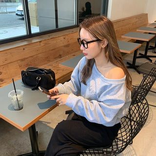 Cubic lettering off-shoulder sweatshirt