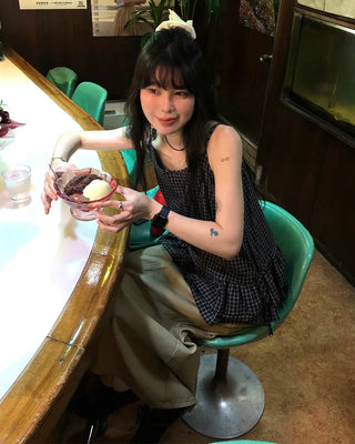 Checked shirred sleeveless blouse