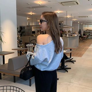 Cubic lettering off-shoulder sweatshirt