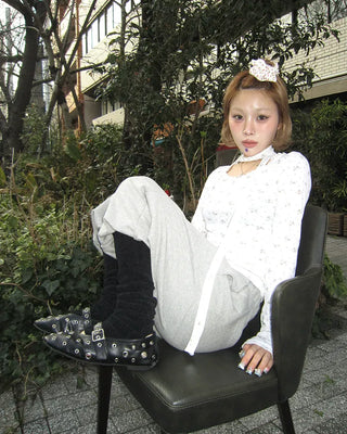 Open-heel ribbed knee-high socks layered pants