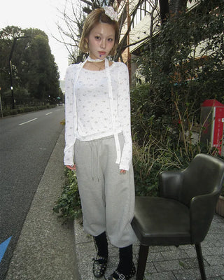 Open-heel ribbed knee-high socks layered pants