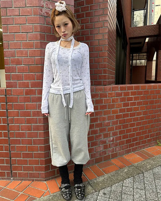 Open-heel ribbed knee-high socks layered pants