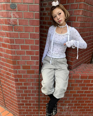 Open-heel ribbed knee-high socks layered pants