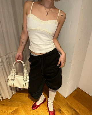 Open-heel ribbed knee-high socks layered pants