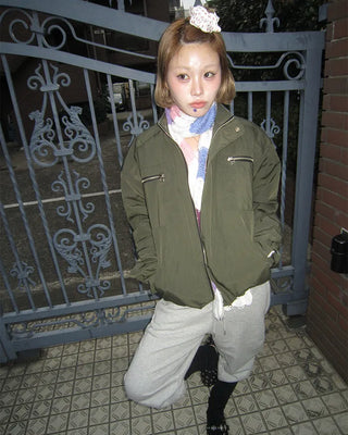 Open-heel ribbed knee-high socks layered pants
