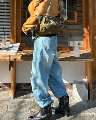 Knee-damaged vintage denim pants