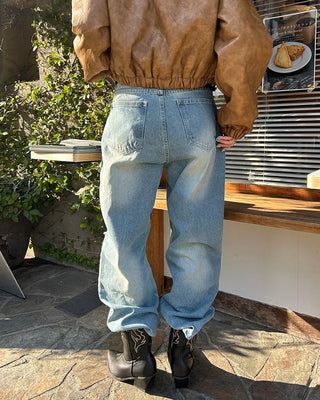 Knee-damaged vintage denim pants