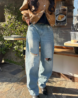 Knee-damaged vintage denim pants