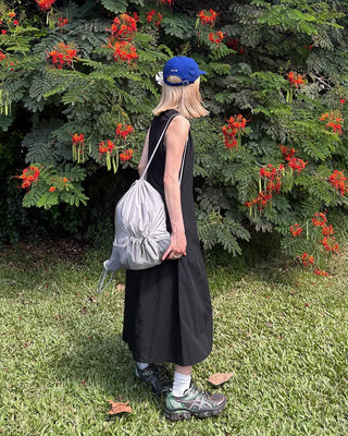 Drawstring net pocket backpack