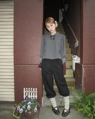 Open-heel ribbed knee-high socks layered pants