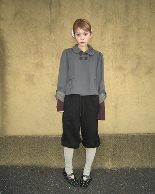 Open-heel ribbed knee-high socks layered pants
