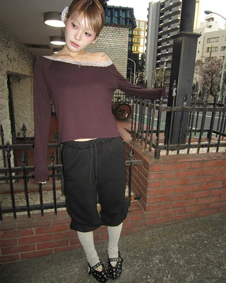 Open-heel ribbed knee-high socks layered pants