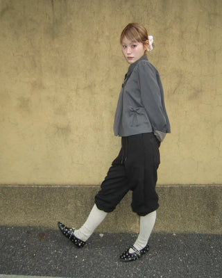Open-heel ribbed knee-high socks layered pants
