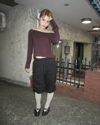Open-heel ribbed knee-high socks layered pants
