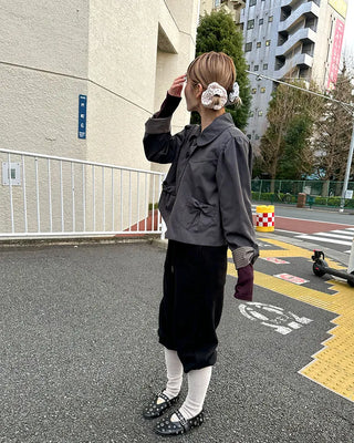 Open-heel ribbed knee-high socks layered pants