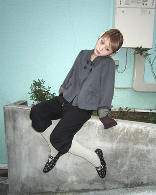Open-heel ribbed knee-high socks layered pants