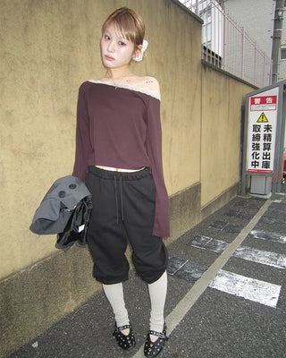 Open-heel ribbed knee-high socks layered pants