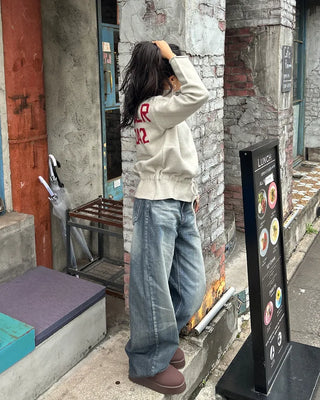 Seam-stitched distressed wide-leg denim pants