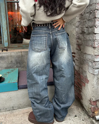 Seam-stitched distressed wide-leg denim pants