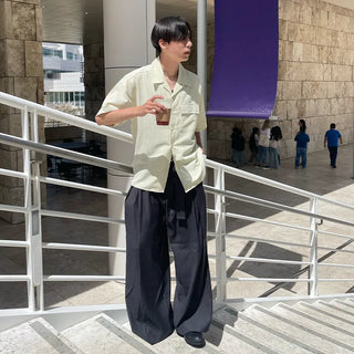 Wide-leg pants with belt and pleats
