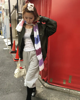 Open-heel ribbed knee-high socks layered pants