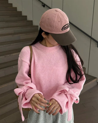 Knit sweater with ribbon detail on the sleeves