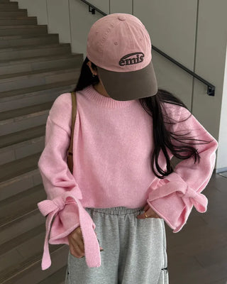 Knit sweater with ribbon detail on the sleeves