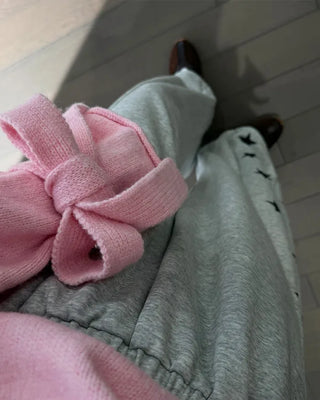 Knit sweater with ribbon detail on the sleeves