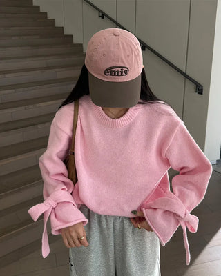 Knit sweater with ribbon detail on the sleeves