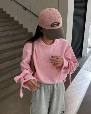 Knit sweater with ribbon detail on the sleeves
