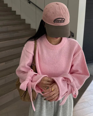 Knit sweater with ribbon detail on the sleeves