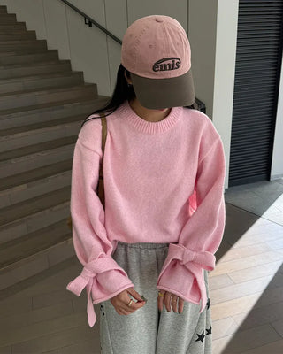 Knit sweater with ribbon detail on the sleeves