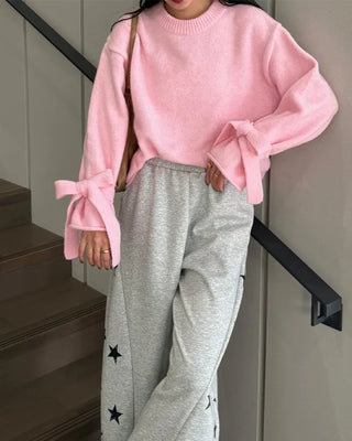 Knit sweater with ribbon detail on the sleeves