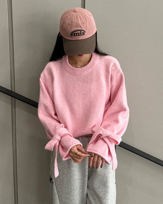 Knit sweater with ribbon detail on the sleeves