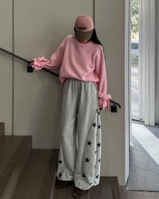 Knit sweater with ribbon detail on the sleeves
