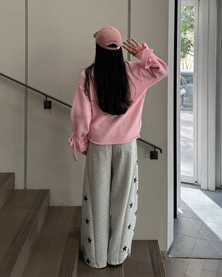 Knit sweater with ribbon detail on the sleeves